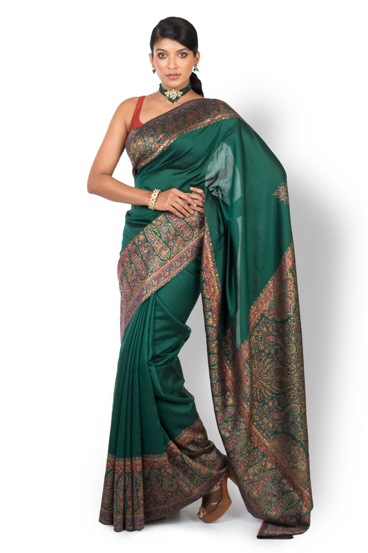 Party Wear Designer Saree In Dark Green Colour